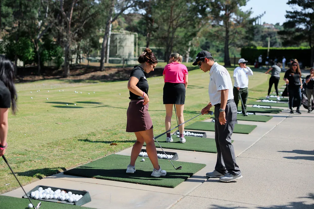 Golfers practising on the driving range
